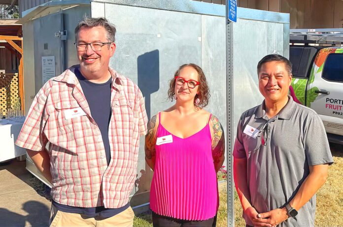 (L to R) Bethlehem House of Bread Pastoral Director Jeff Lowry, Portland Fruit Tree Project Executive Director Heather Kiesler and Tigard Mayor Yi-Kang Hu pose in front of the new refrigerator installed at Bethlehem House of Bread.