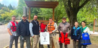 Portable Life Jacket Kiosk Placed at Cook Park Tigard City Councilor Faraz Ghoddusi, Tualatin River Keepers Program Manager Mark Fitzsimons, Randy Scherman from the Nautical Safety Foundation, volunteer Darren Wilhoit, boy scout Quinton Shepard and others gathered around the new kiosk at Cook Park.