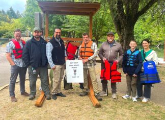 Portable Life Jacket Kiosk Placed at Cook Park Tigard City Councilor Faraz Ghoddusi, Tualatin River Keepers Program Manager Mark Fitzsimons, Randy Scherman from the Nautical Safety Foundation, volunteer Darren Wilhoit, boy scout Quinton Shepard and others gathered around the new kiosk at Cook Park.