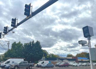 Tigard Traffic Cameras Show Results – and Challenges Traffic cameras at the intersection of Southwest Pacific Highway and Hall Boulevard monitor speed and red-light violations.