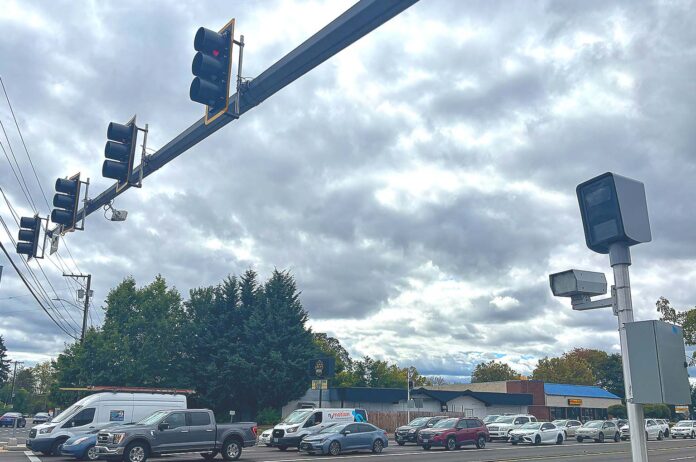 Traffic cameras at the intersection of Southwest Pacific Highway and Hall Boulevard monitor speed and red-light violations.