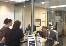 Tigard Council Weighs Credit Card Fees for Utility Customers Tigard residents at the Tigard utility billing office at City Hall on Sept. 22.