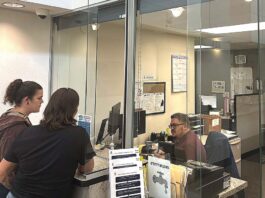 Tigard Council Weighs Credit Card Fees for Utility Customers Tigard residents at the Tigard utility billing office at City Hall on Sept. 22.
