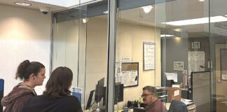 Tigard Council Weighs Credit Card Fees for Utility Customers Tigard residents at the Tigard utility billing office at City Hall on Sept. 22.