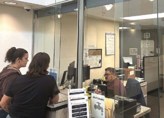 Tigard Council Weighs Credit Card Fees for Utility Customers Tigard residents at the Tigard utility billing office at City Hall on Sept. 22.