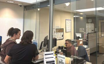 Tigard Council Weighs Credit Card Fees for Utility Customers Tigard residents at the Tigard utility billing office at City Hall on Sept. 22.